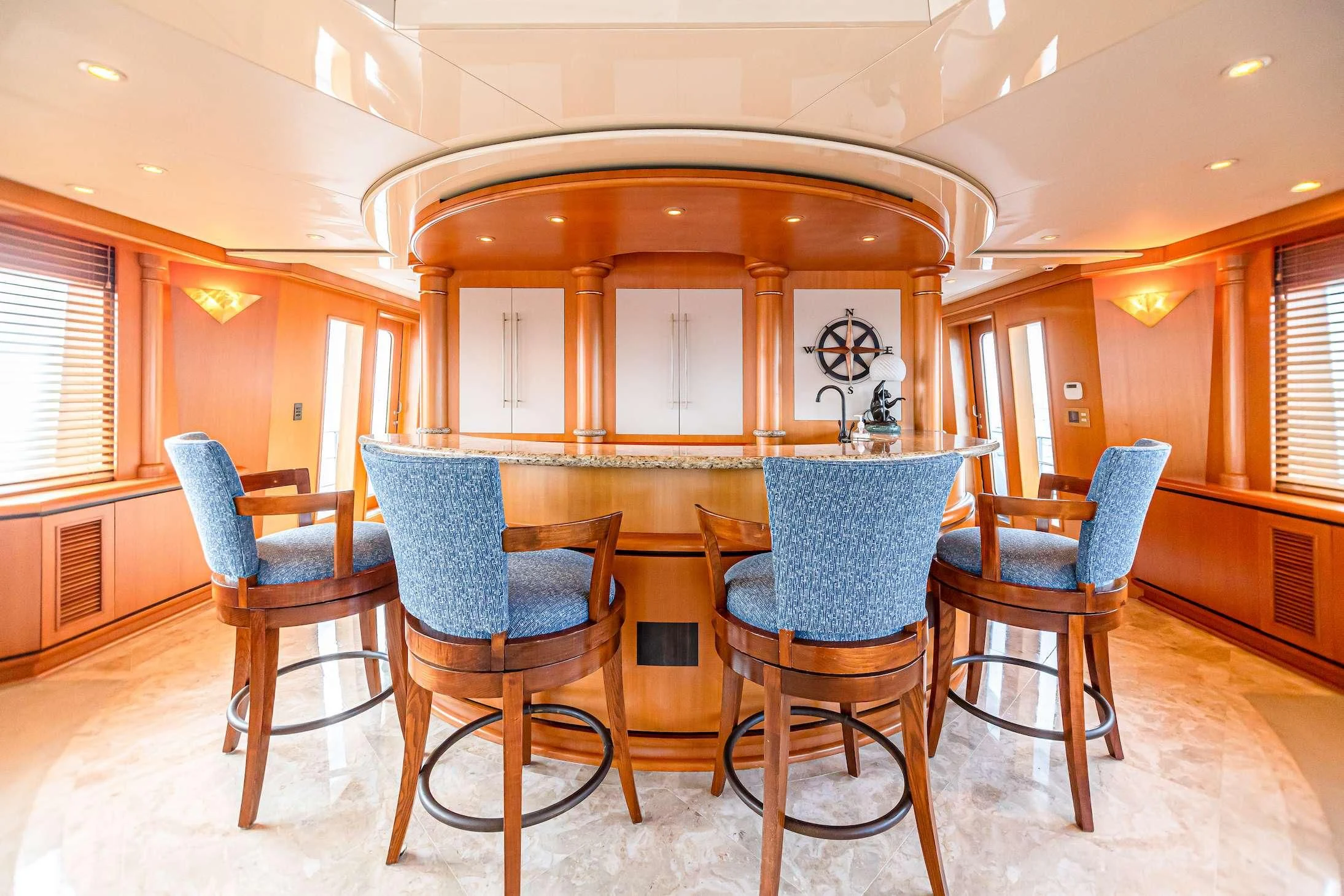 a table and chairs in a room aboard XOXO Yacht for Charter