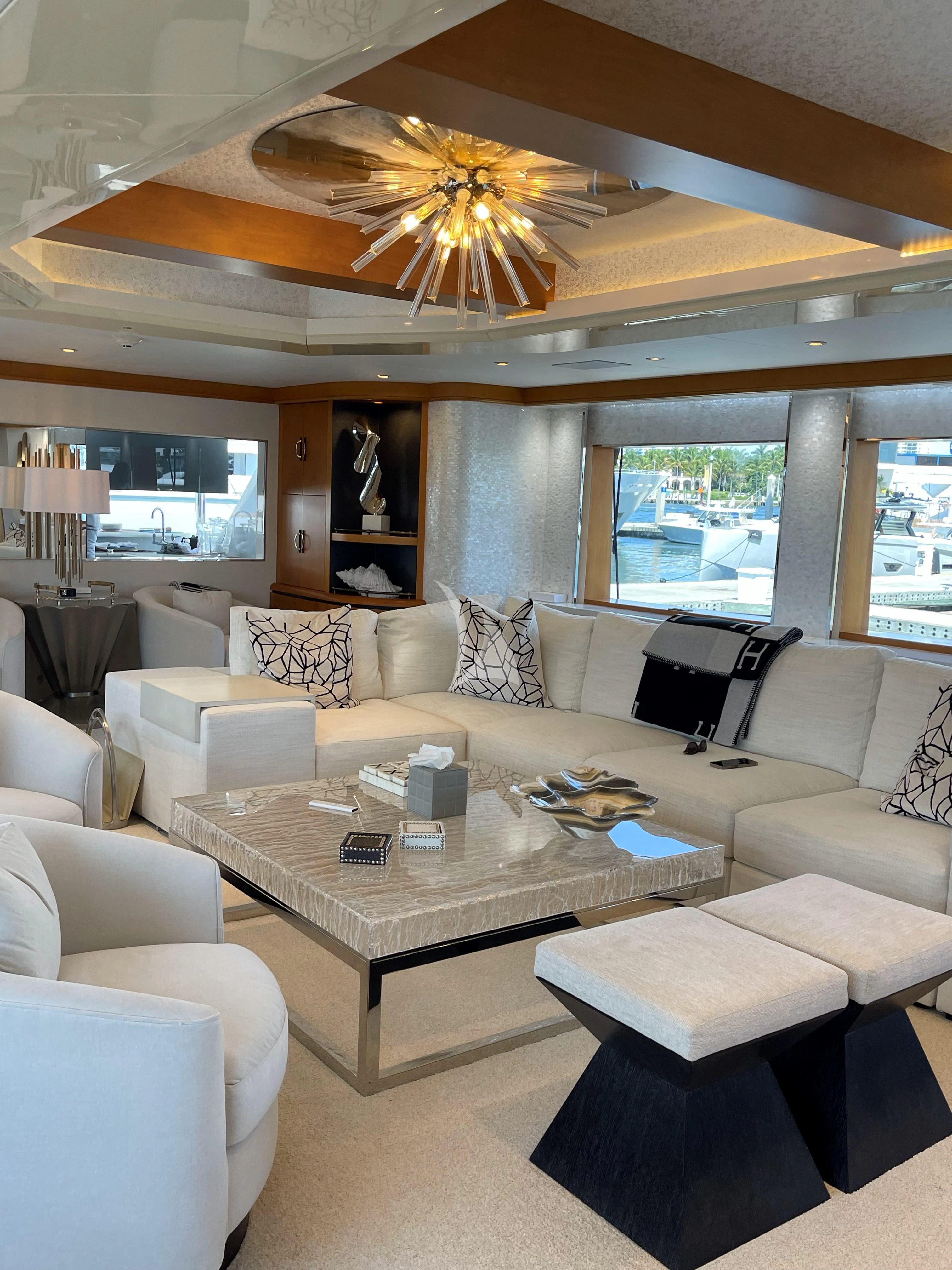 a living room with a large ceiling fan aboard XOXO Yacht for Charter