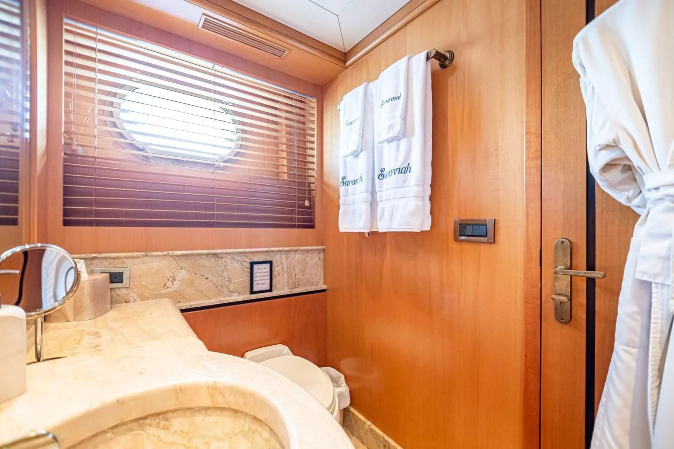 a bathroom with a sink and a toilet aboard XOXO Yacht for Charter