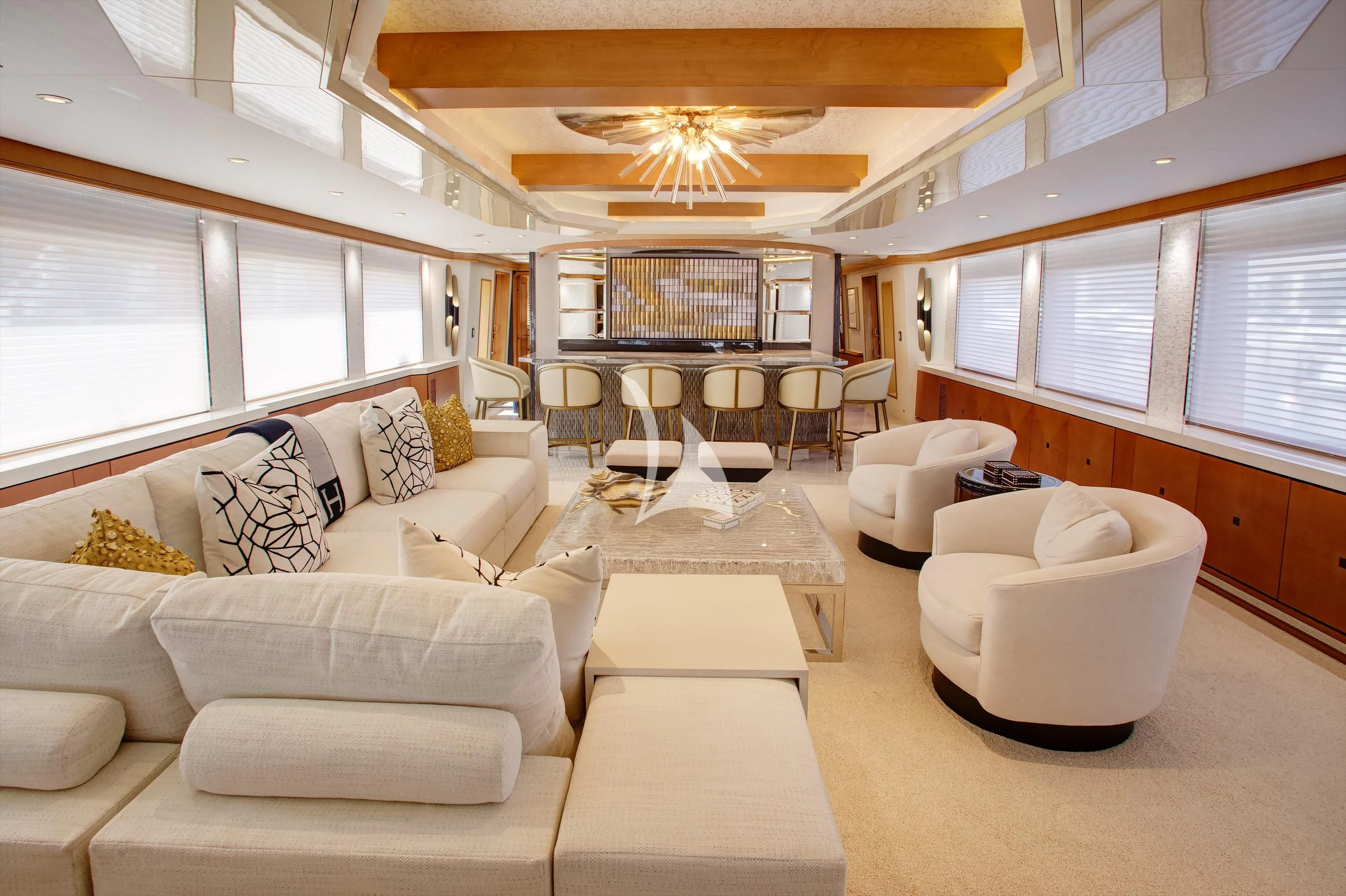 a living room with a couch and a table aboard XOXO Yacht for Charter