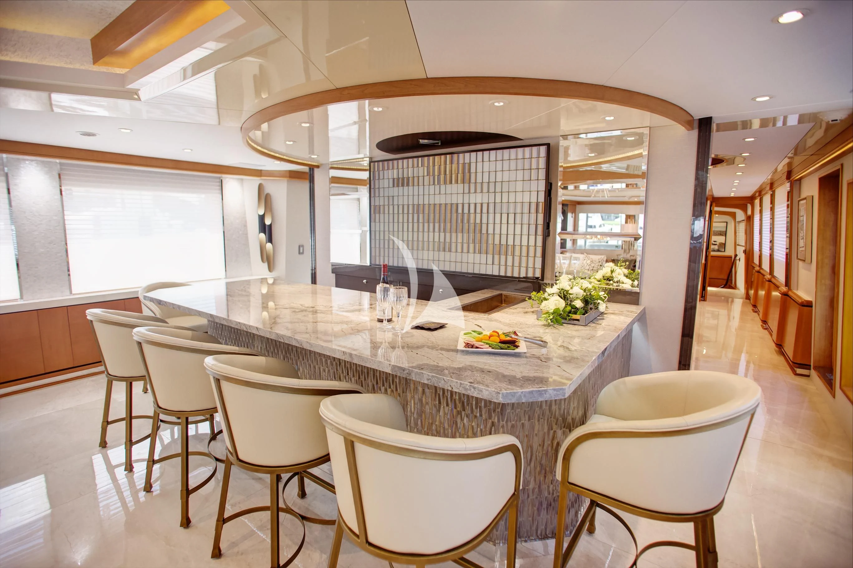 a large kitchen with a table and chairs aboard XOXO Yacht for Charter