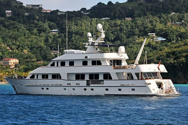 a large white boat in the water aboard LIGAYA Yacht for Sale