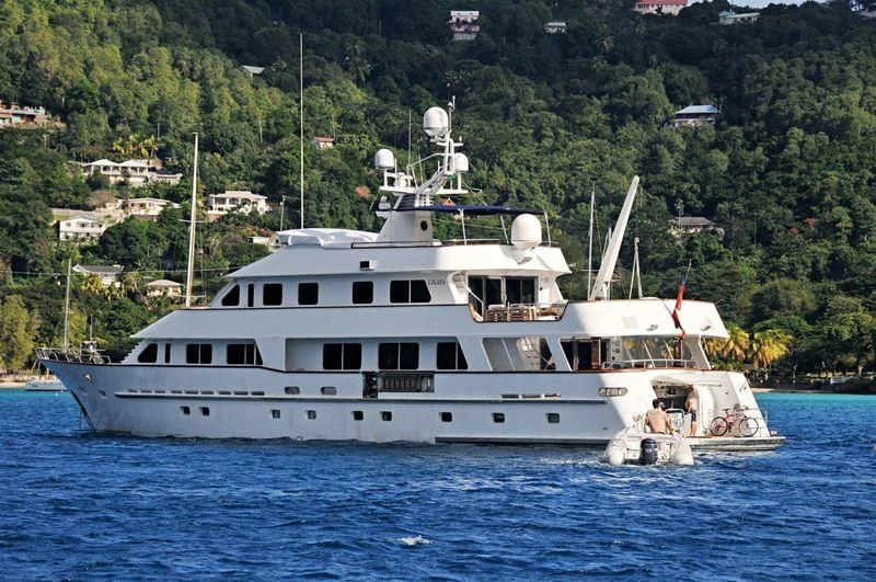 a white boat on the water aboard LIGAYA Yacht for Sale