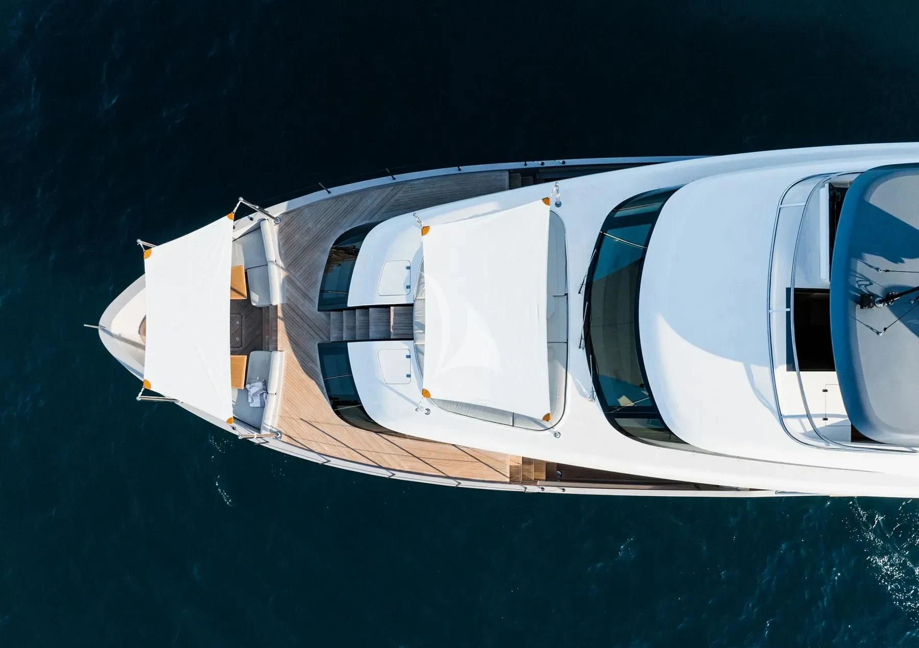 a white boat in the water aboard AKIRA Yacht for Sale