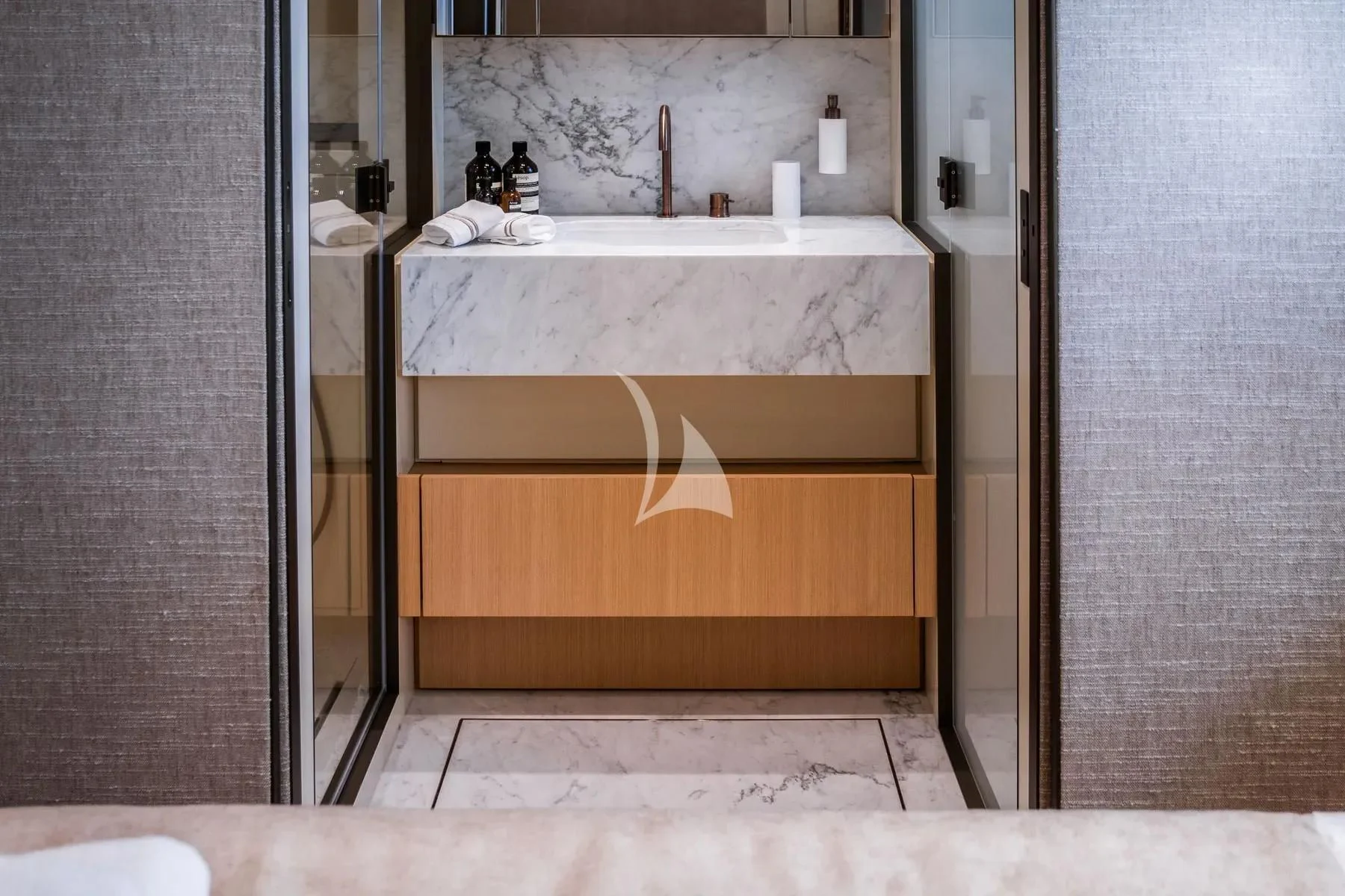 a bathroom sink with a mirror aboard AKIRA Yacht for Sale