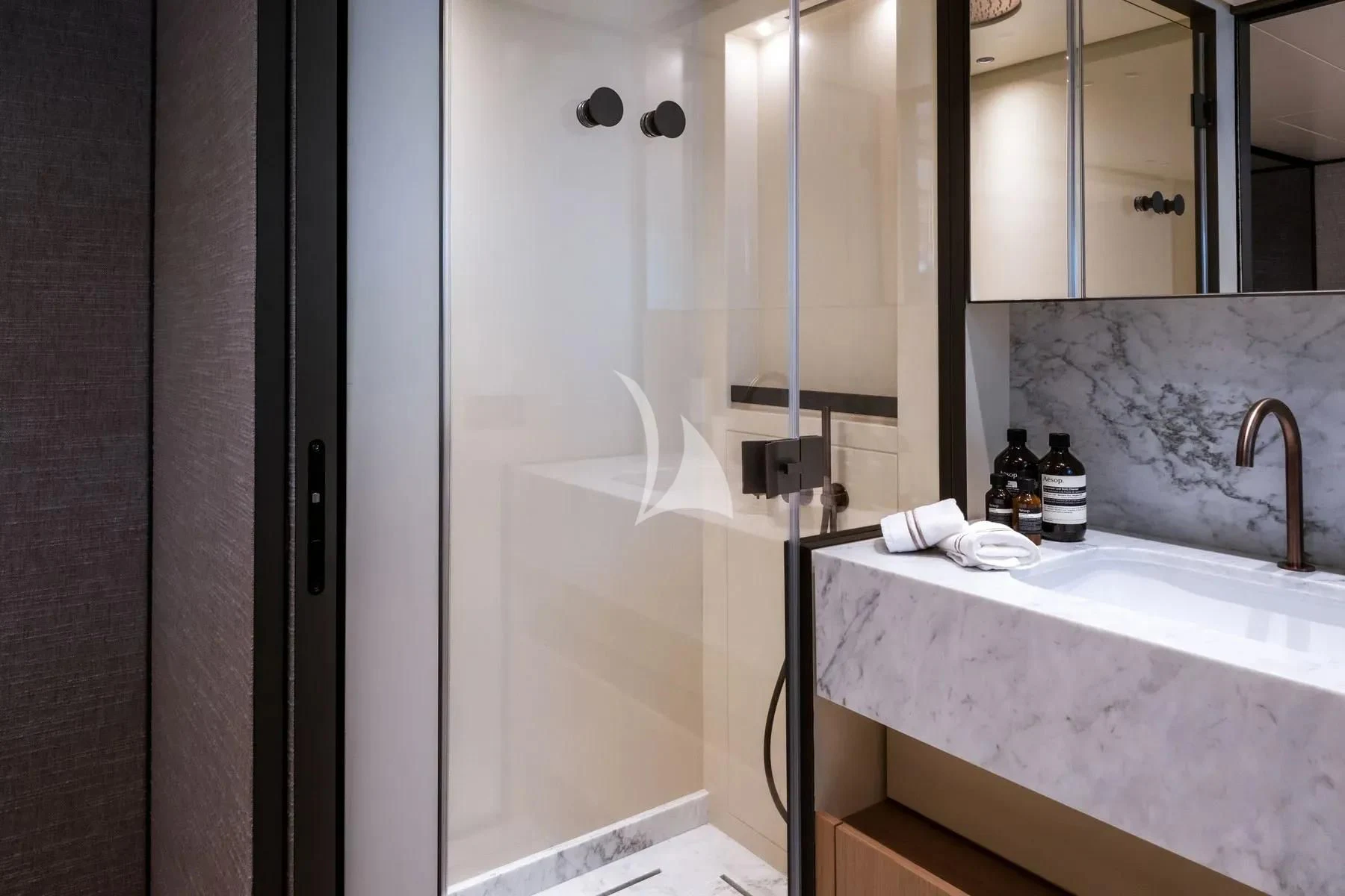 a bathroom with a glass shower aboard AKIRA Yacht for Sale