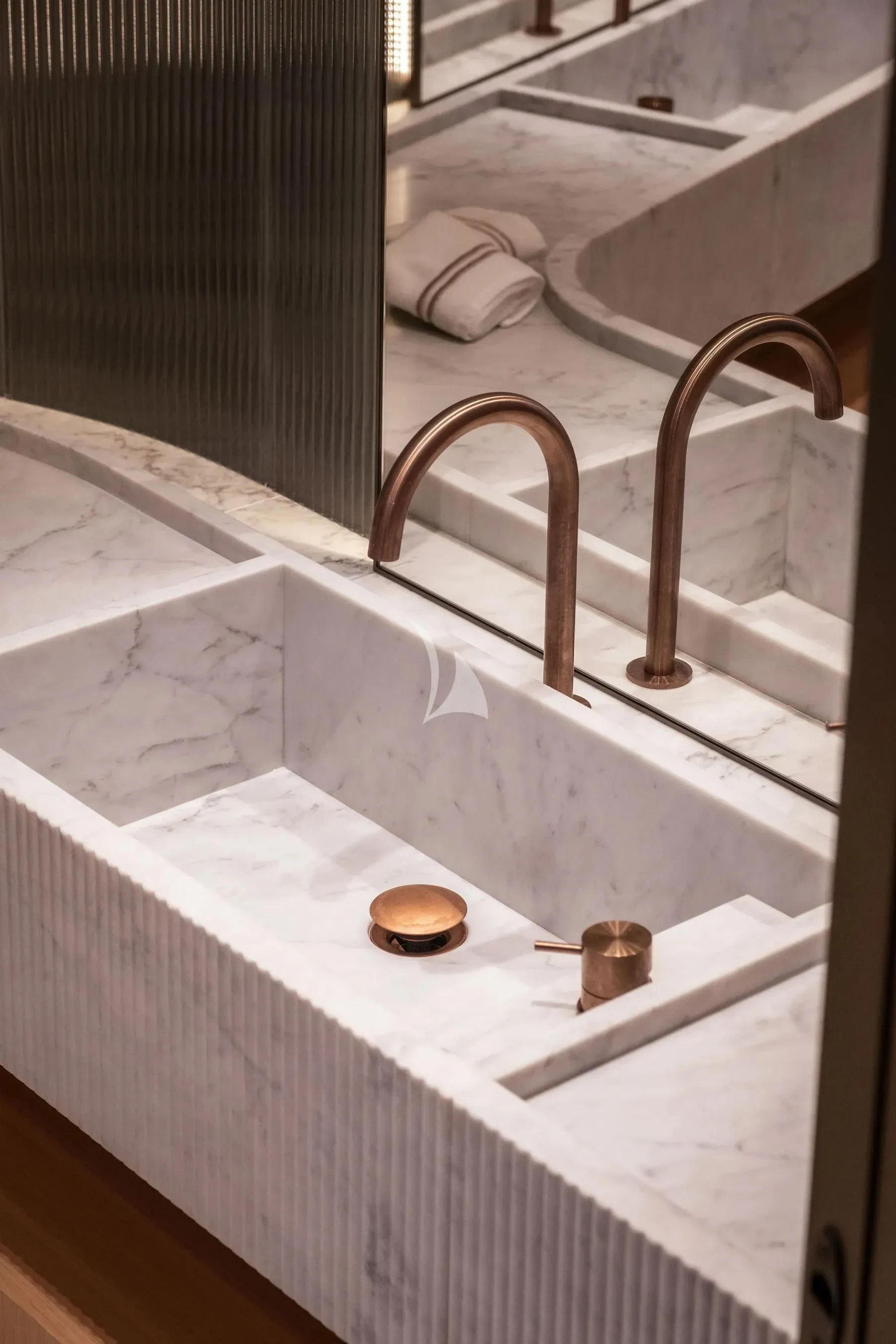 a white counter top with a brown object on it aboard AKIRA Yacht for Sale