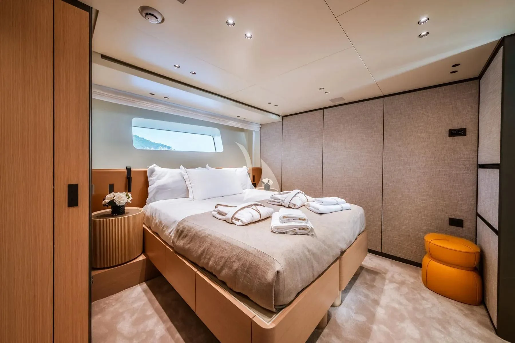 a room with a bed and a window aboard AKIRA Yacht for Sale