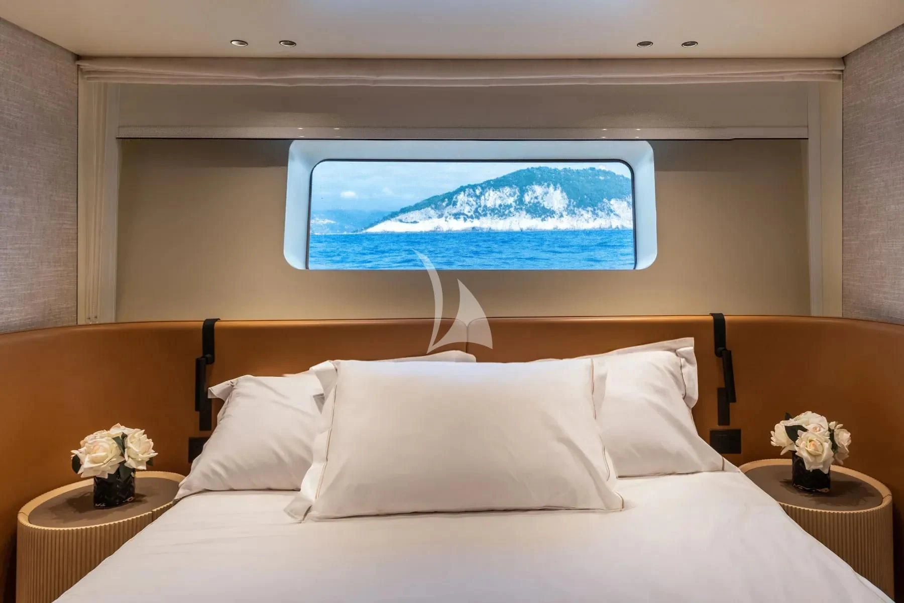 a bed with white sheets and pillows aboard AKIRA Yacht for Sale