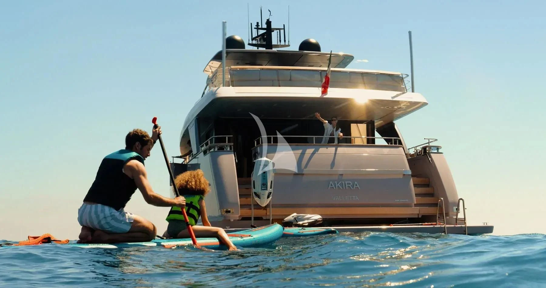a person and a child on a boat in the water aboard AKIRA Yacht for Sale