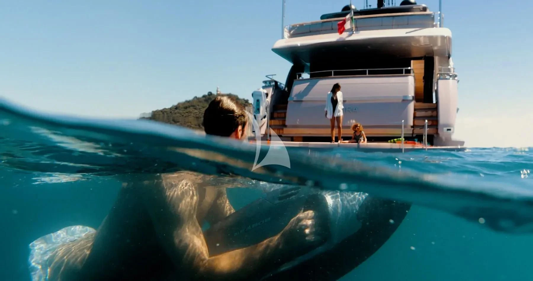 a man and a woman standing on a boat in the water aboard AKIRA Yacht for Sale