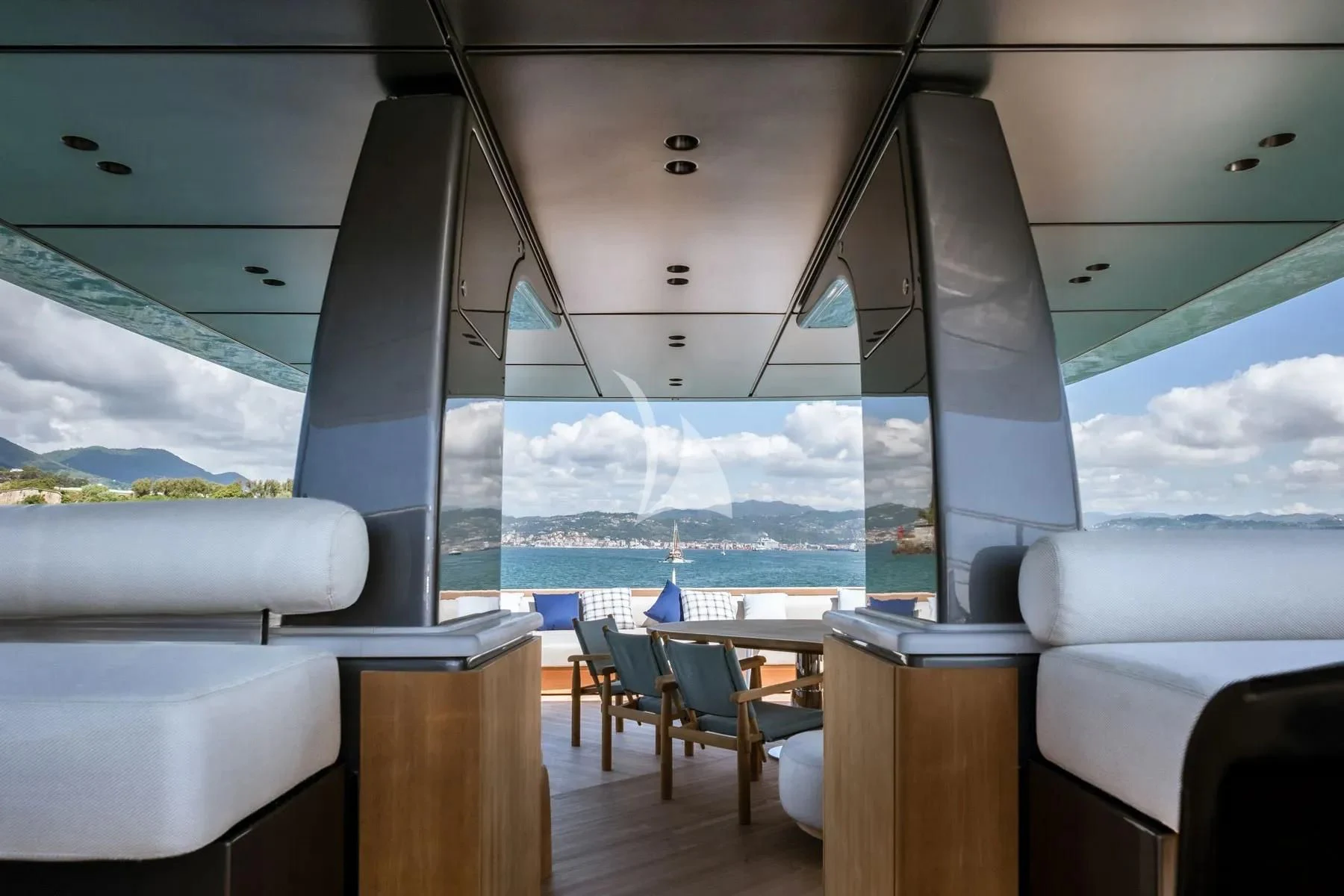 a room with a view of the water and a city aboard AKIRA Yacht for Sale