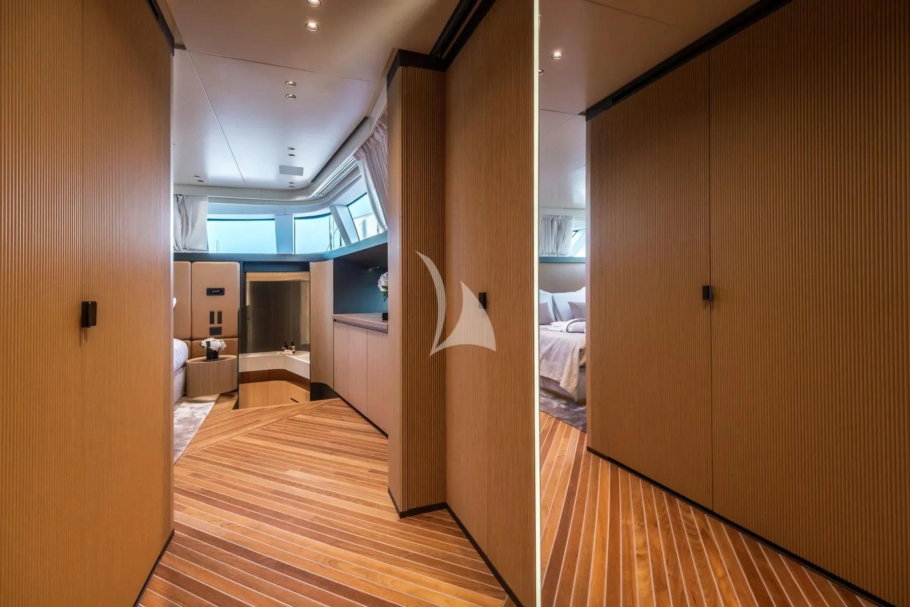 a room with a wood floor and a wood door aboard AKIRA Yacht for Sale