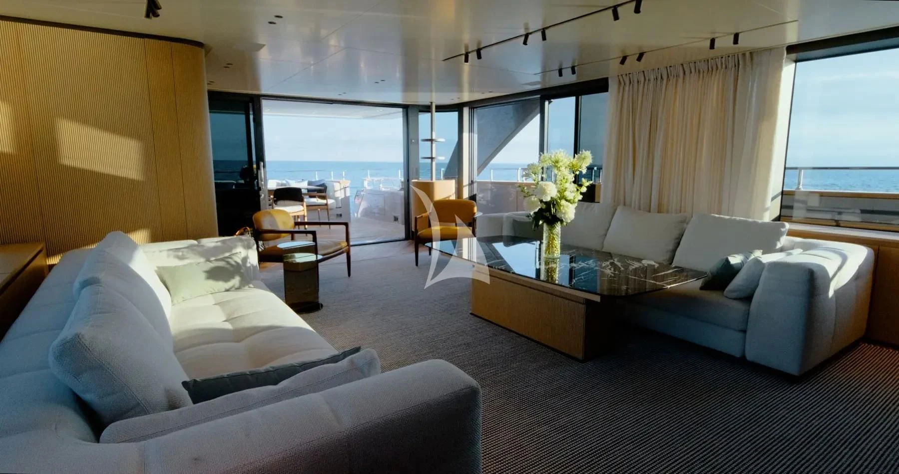 a living room with a couch and a coffee table aboard AKIRA Yacht for Sale