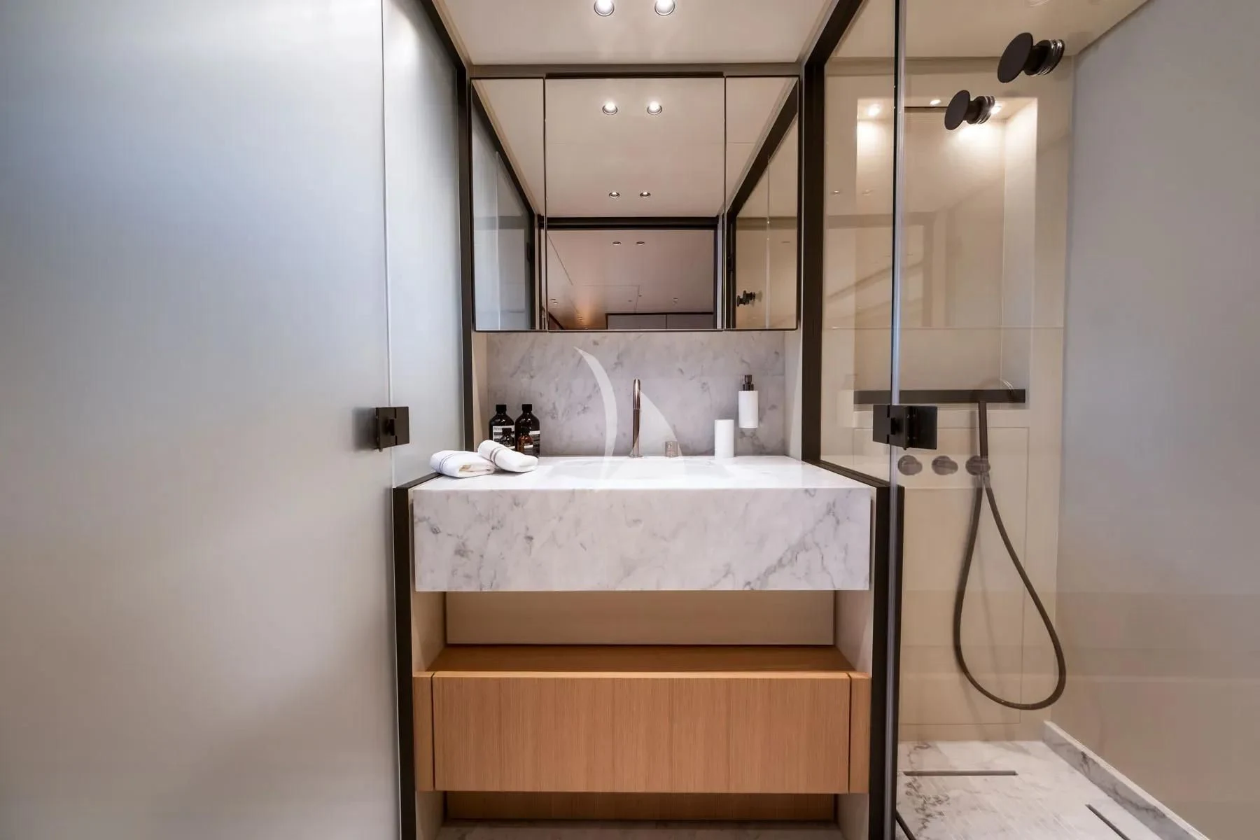 a bathroom with a sink and a mirror aboard AKIRA Yacht for Sale