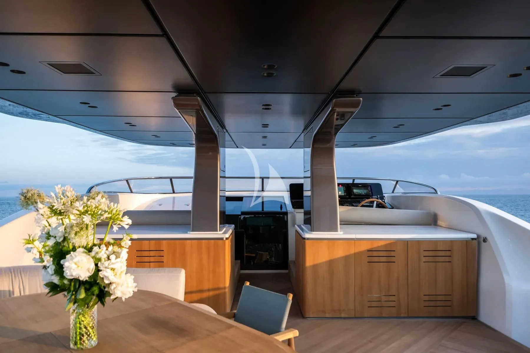 a room with a table and chairs aboard AKIRA Yacht for Sale