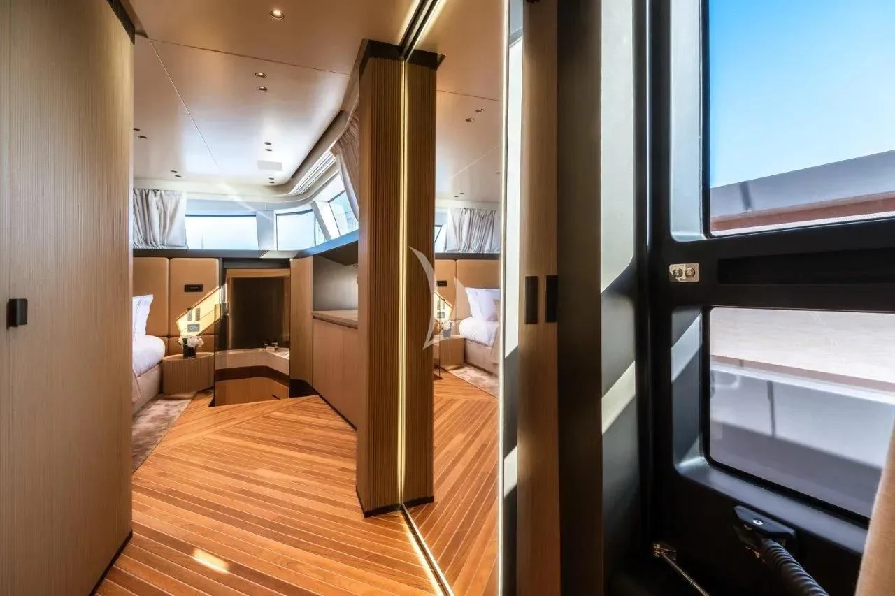 a room with a wood floor and a large window with a wood floor aboard AKIRA Yacht for Sale