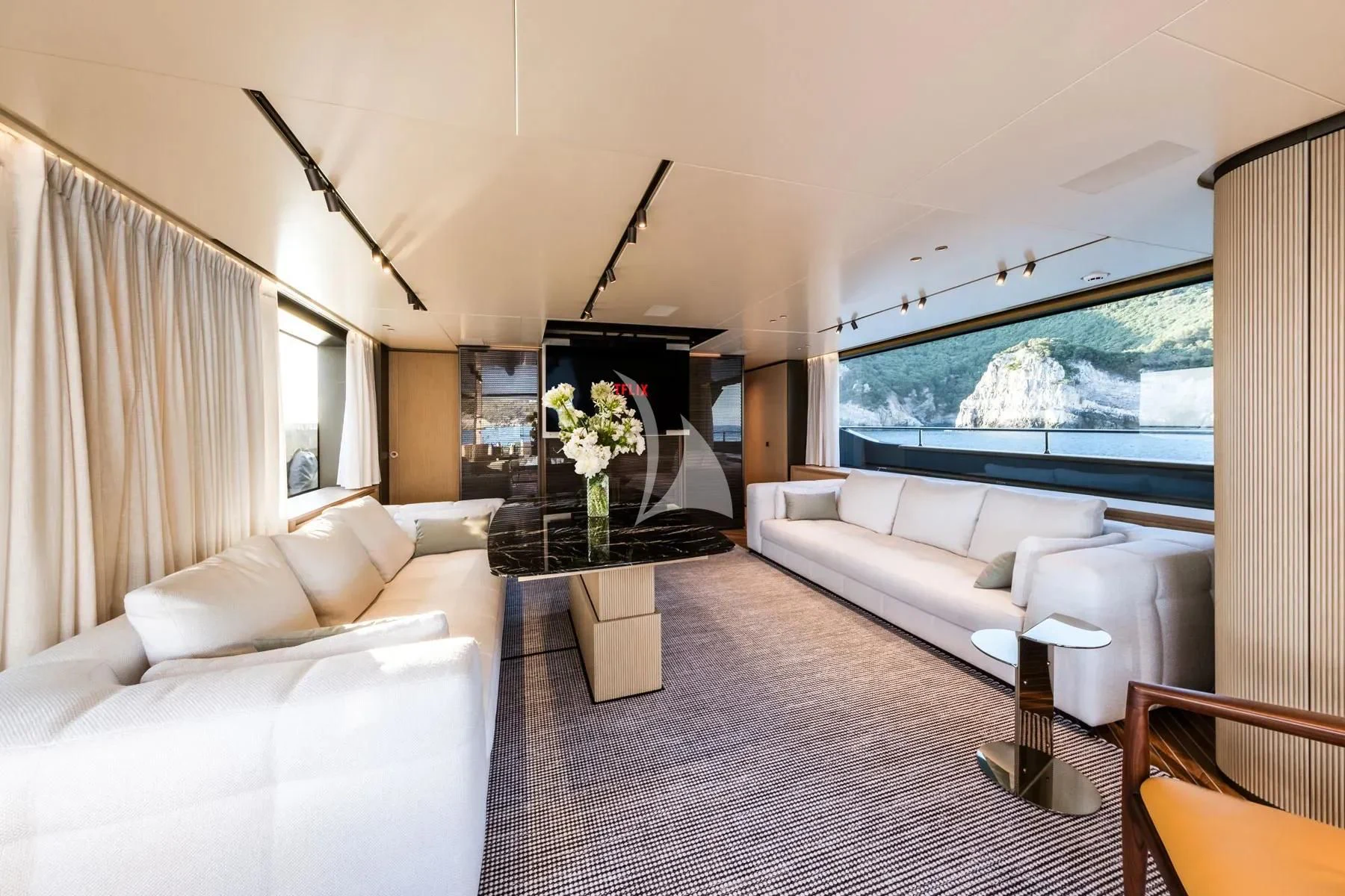 a living room with a large window aboard AKIRA Yacht for Sale