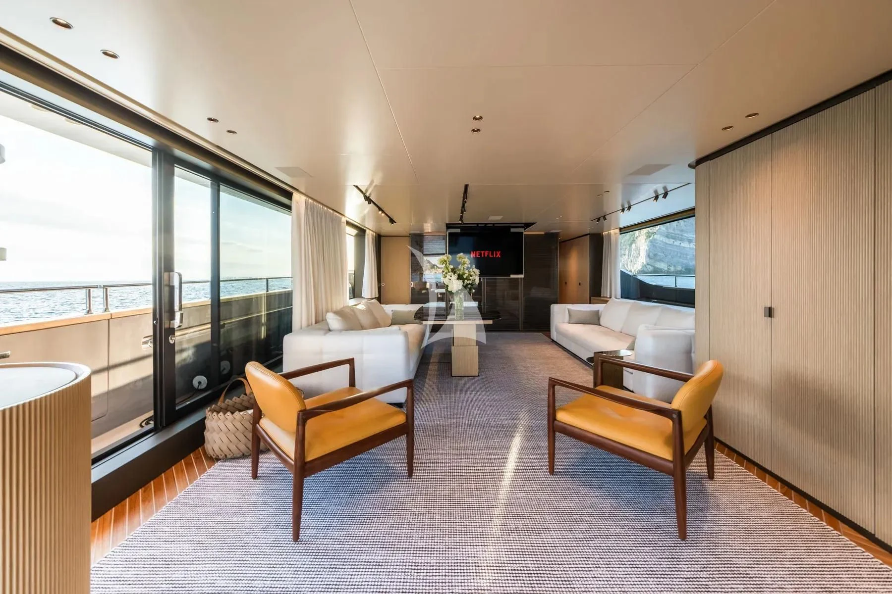 a room with a couch and chairs aboard AKIRA Yacht for Sale