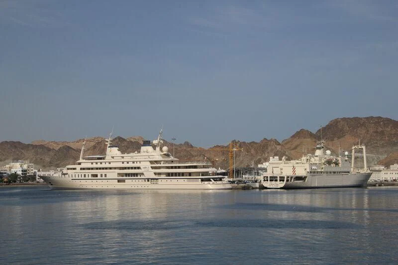 a large white ship in the water aboard DHAFI Yacht for Sale