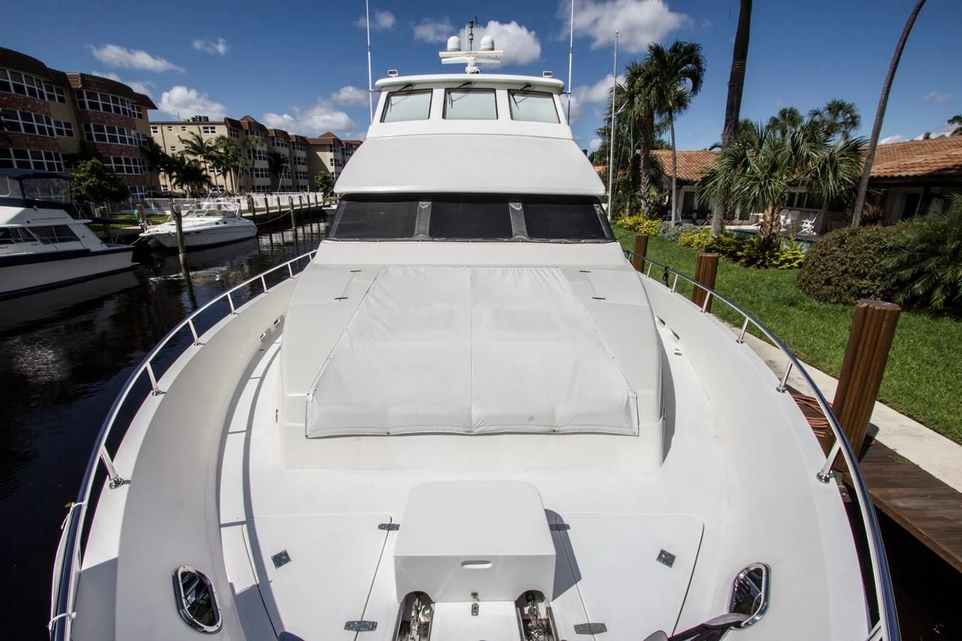 a large white boat in a harbor aboard KISMET Yacht for Sale
