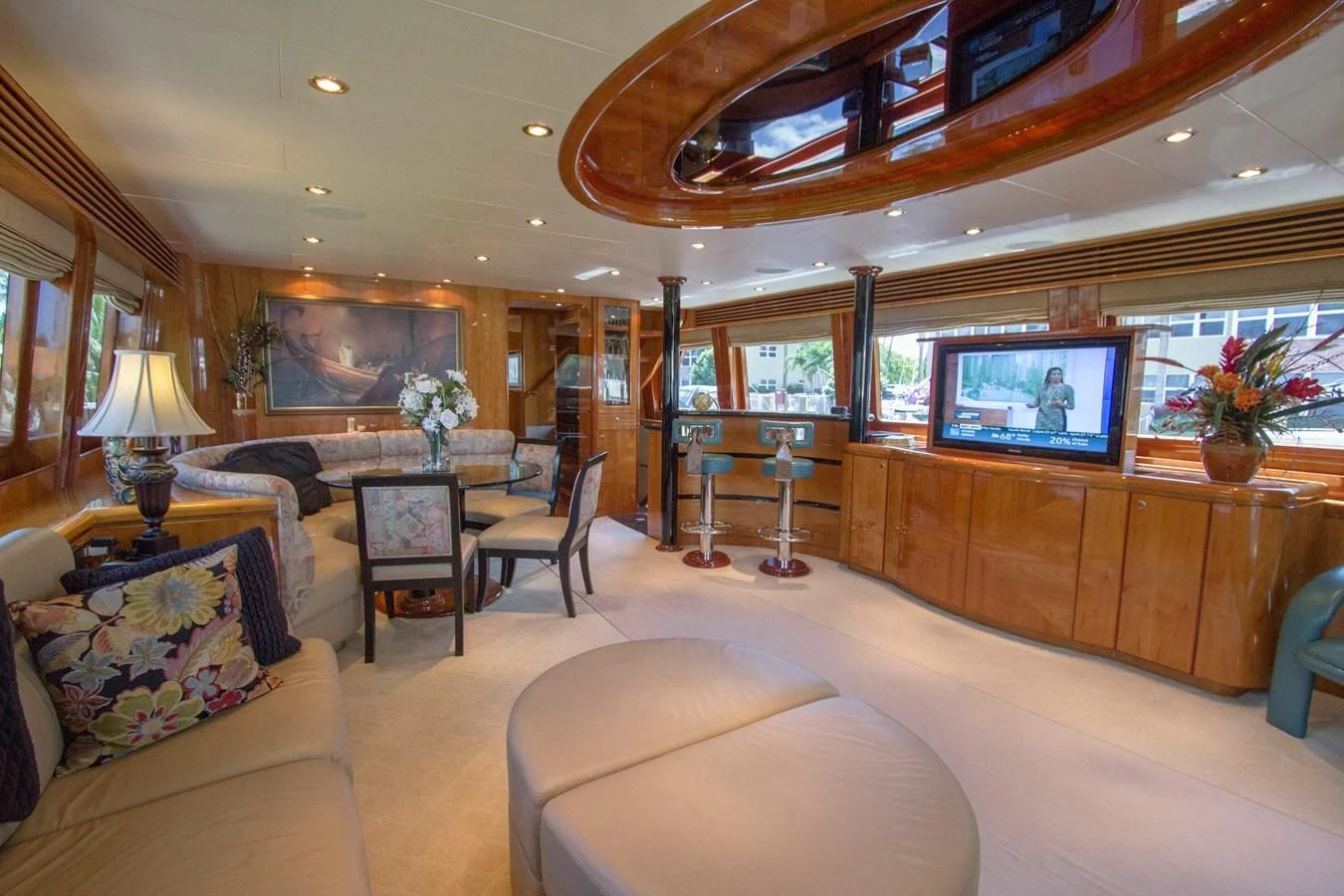 a living room with a large television aboard KISMET Yacht for Sale