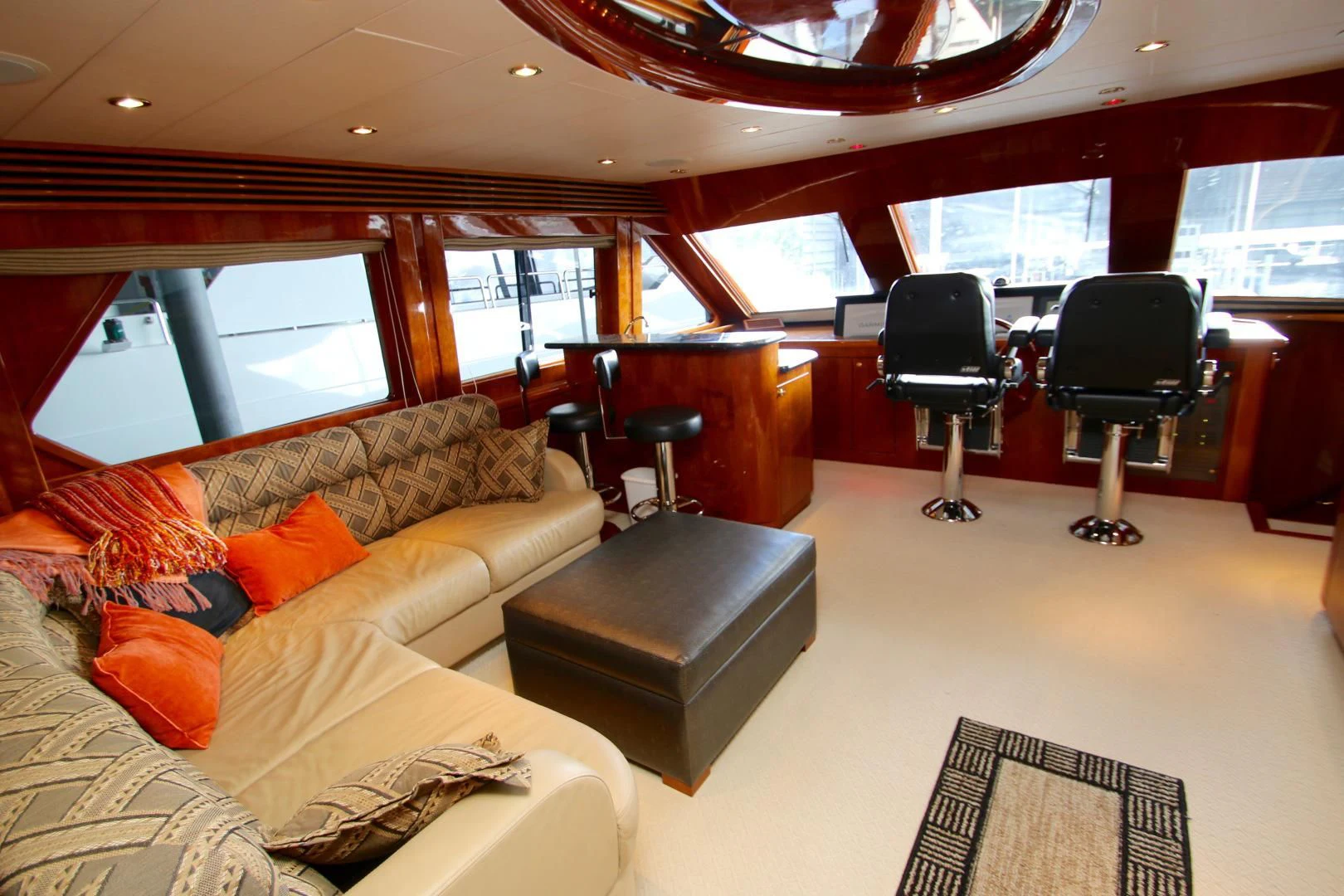 a room with a couch and a table and chairs aboard KISMET Yacht for Sale
