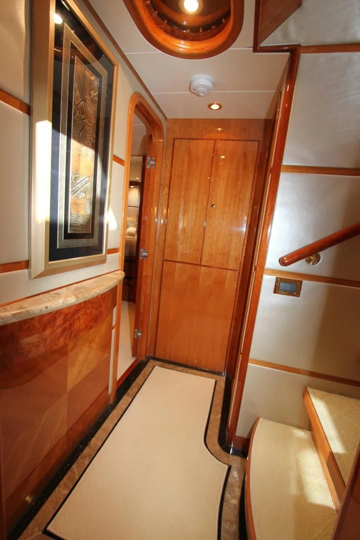 a room with wooden cabinets aboard KISMET Yacht for Sale