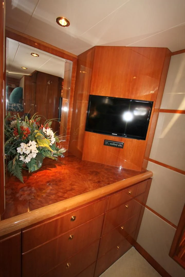 a tv on a cabinet aboard KISMET Yacht for Sale