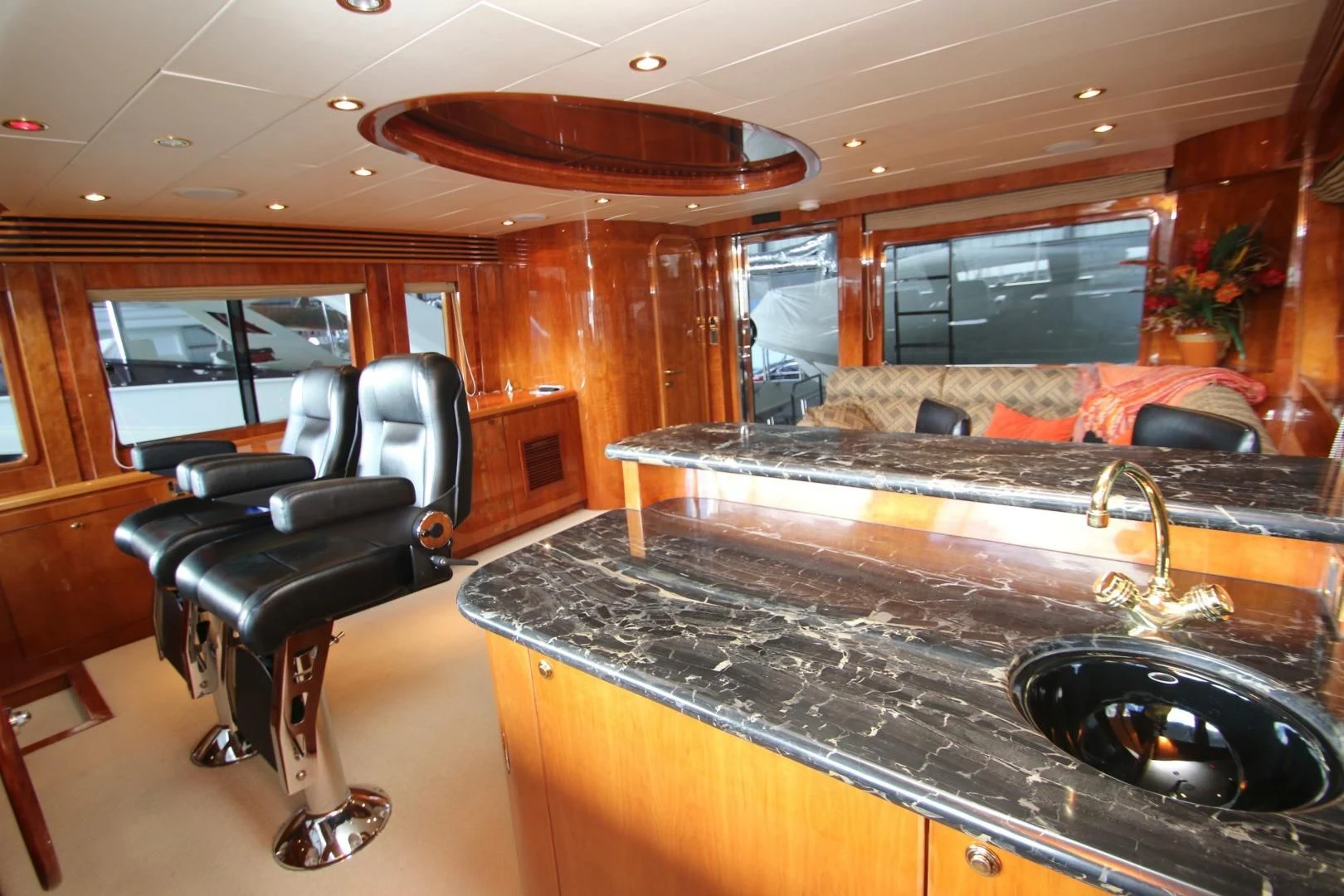a kitchen with a bar and a grill aboard KISMET Yacht for Sale