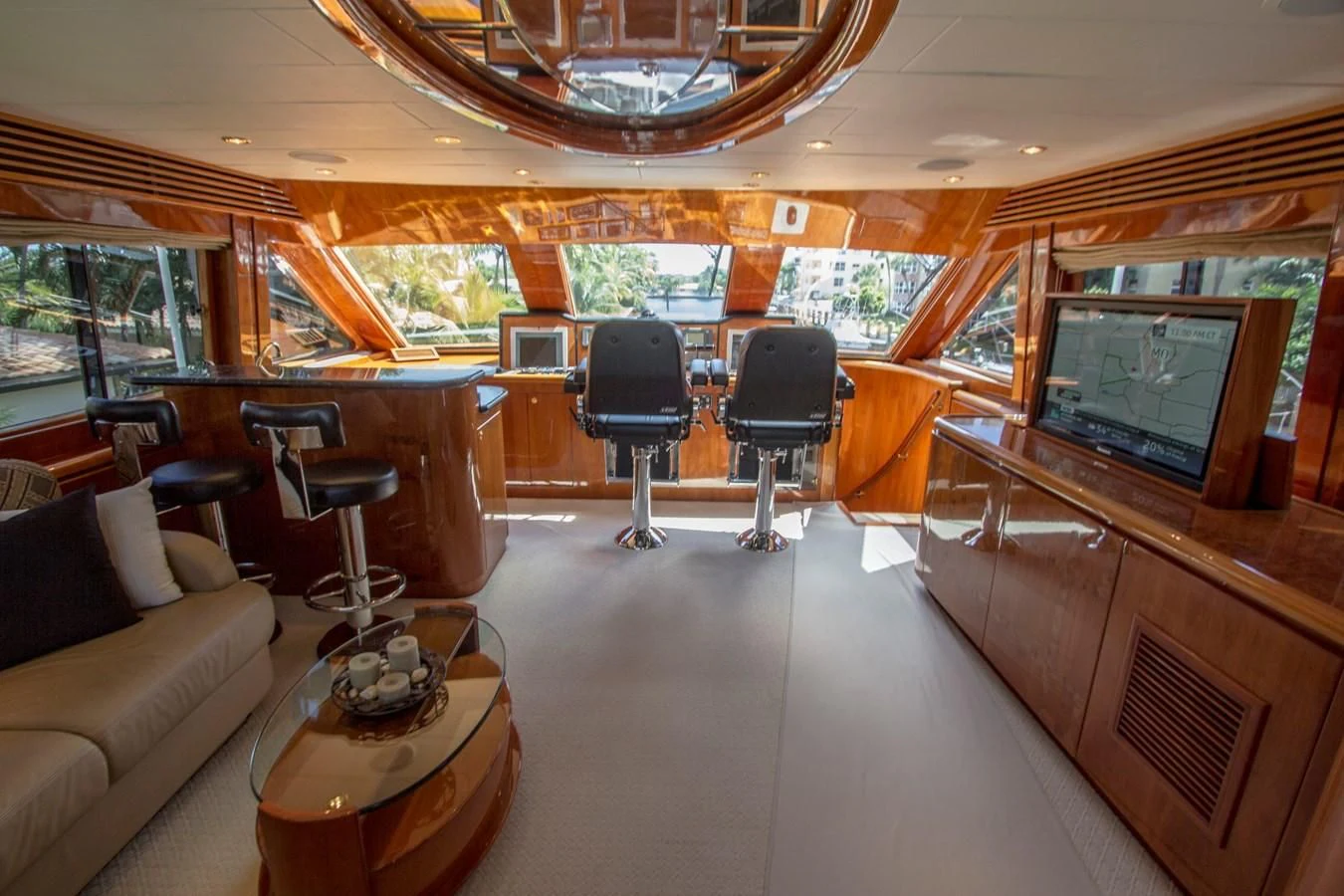 a living room with a large screen aboard KISMET Yacht for Sale