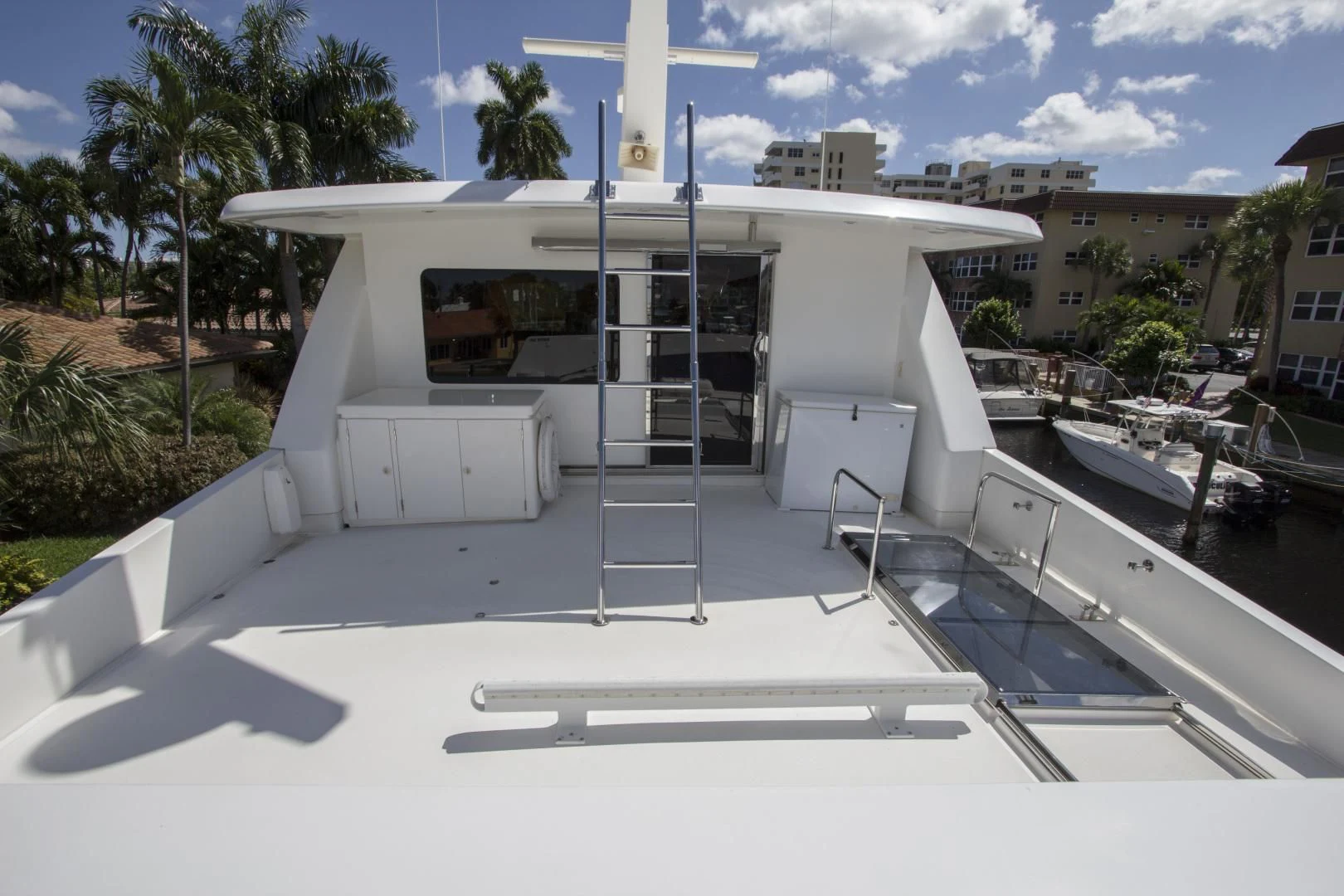 a white building with a glass door aboard KISMET Yacht for Sale