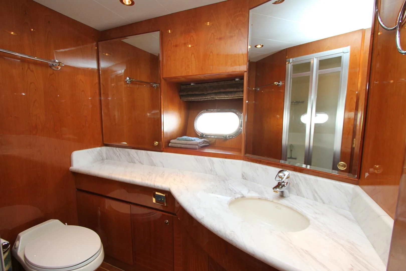 a bathroom with a sink and a mirror aboard KISMET Yacht for Sale