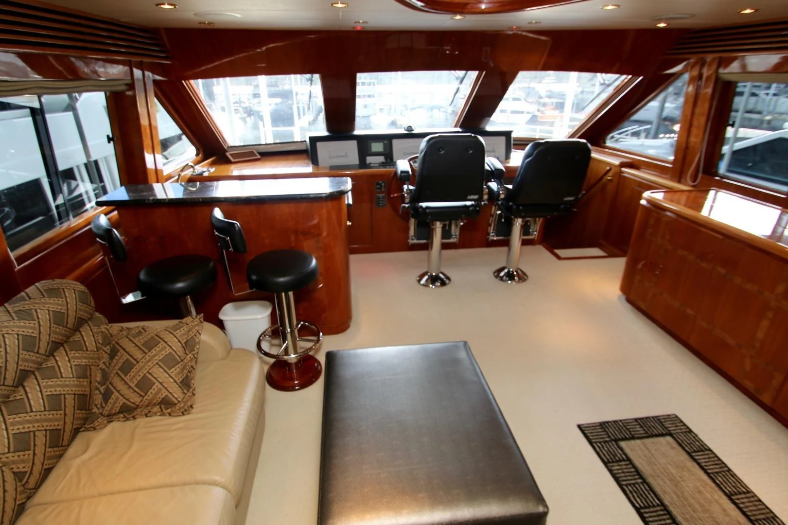 a room with a table chairs and a couch aboard KISMET Yacht for Sale