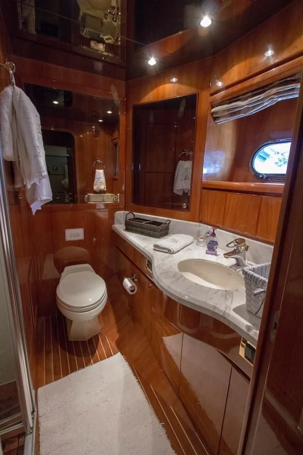 a bathroom with a sink and toilet aboard KISMET Yacht for Sale