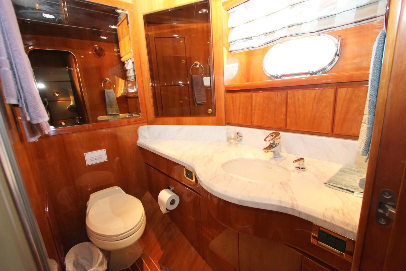 a bathroom with a toilet and sink aboard KISMET Yacht for Sale