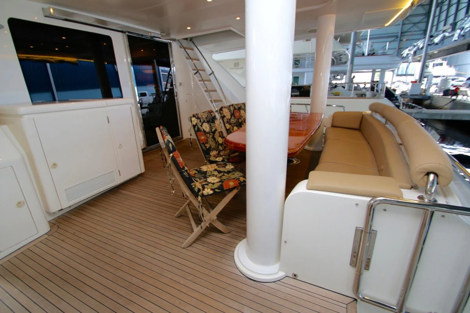 a room with a couch and a table and chairs aboard KISMET Yacht for Sale