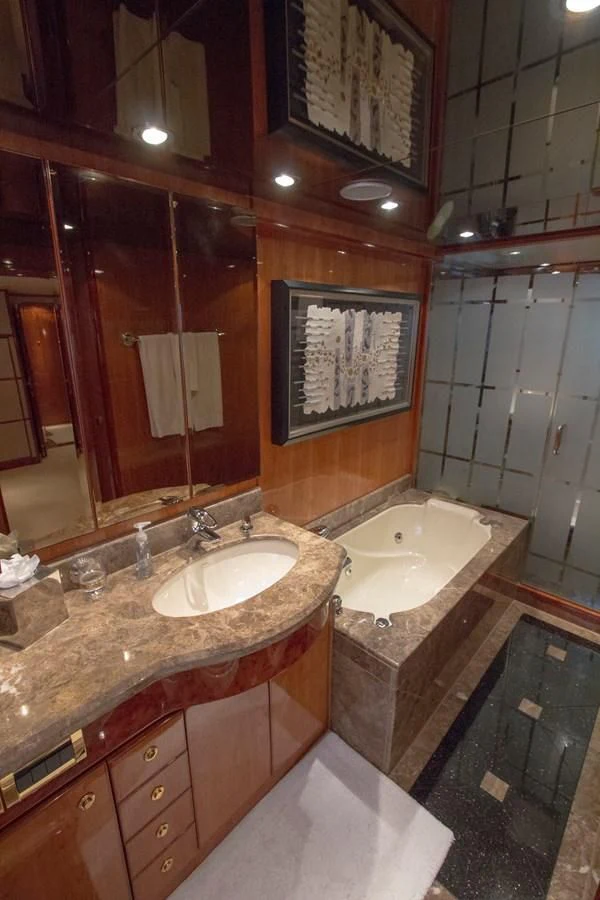 a bathroom with a large mirror aboard KISMET Yacht for Sale