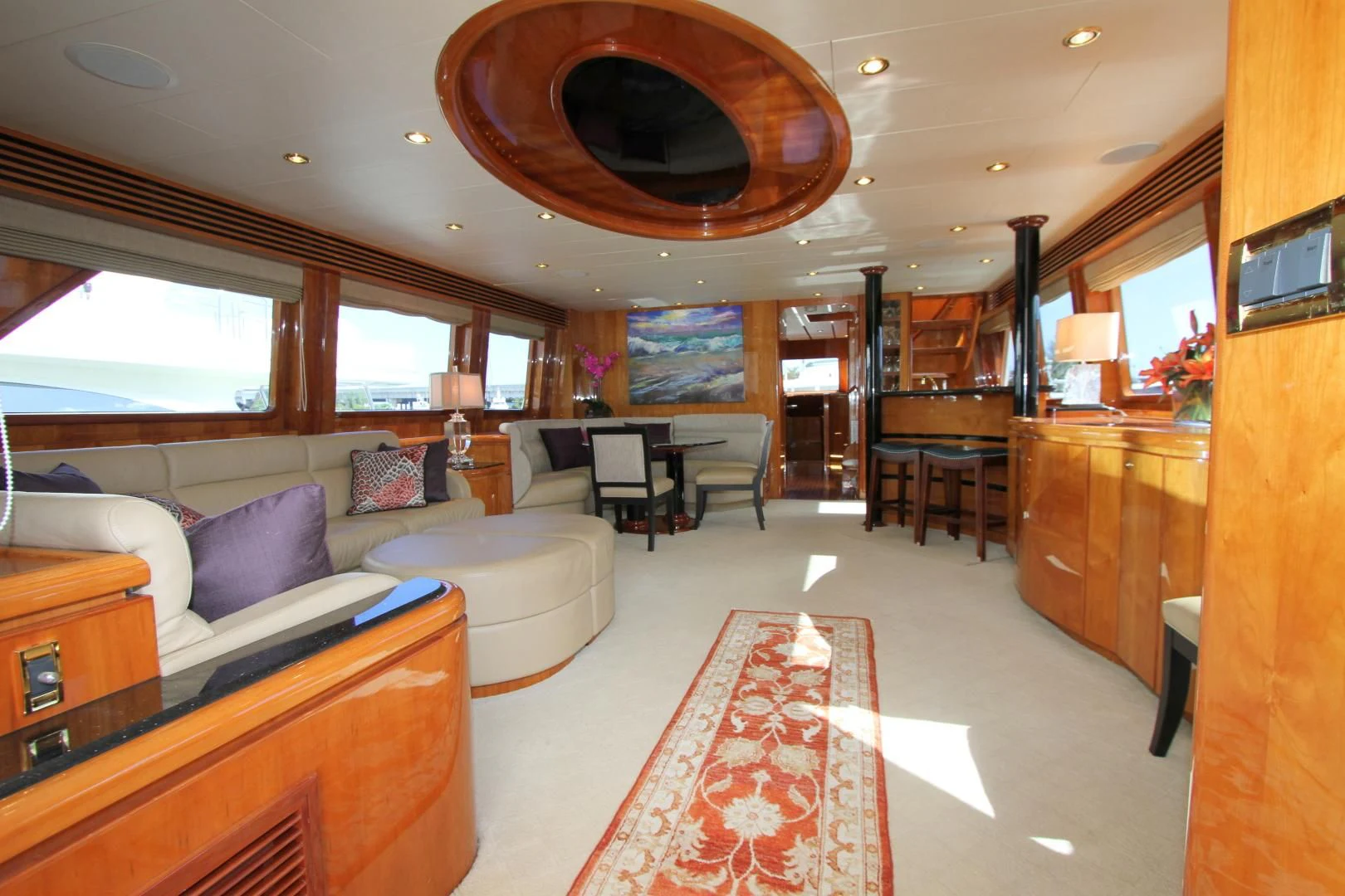 a living room with a large chandelier aboard KISMET Yacht for Sale