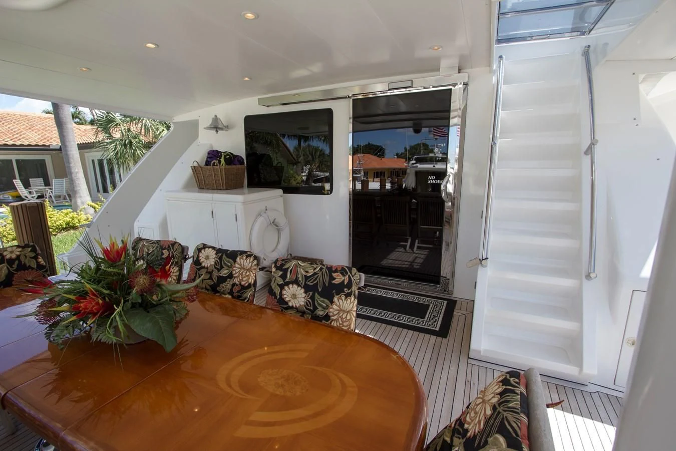 a living room with a table and chairs aboard KISMET Yacht for Sale