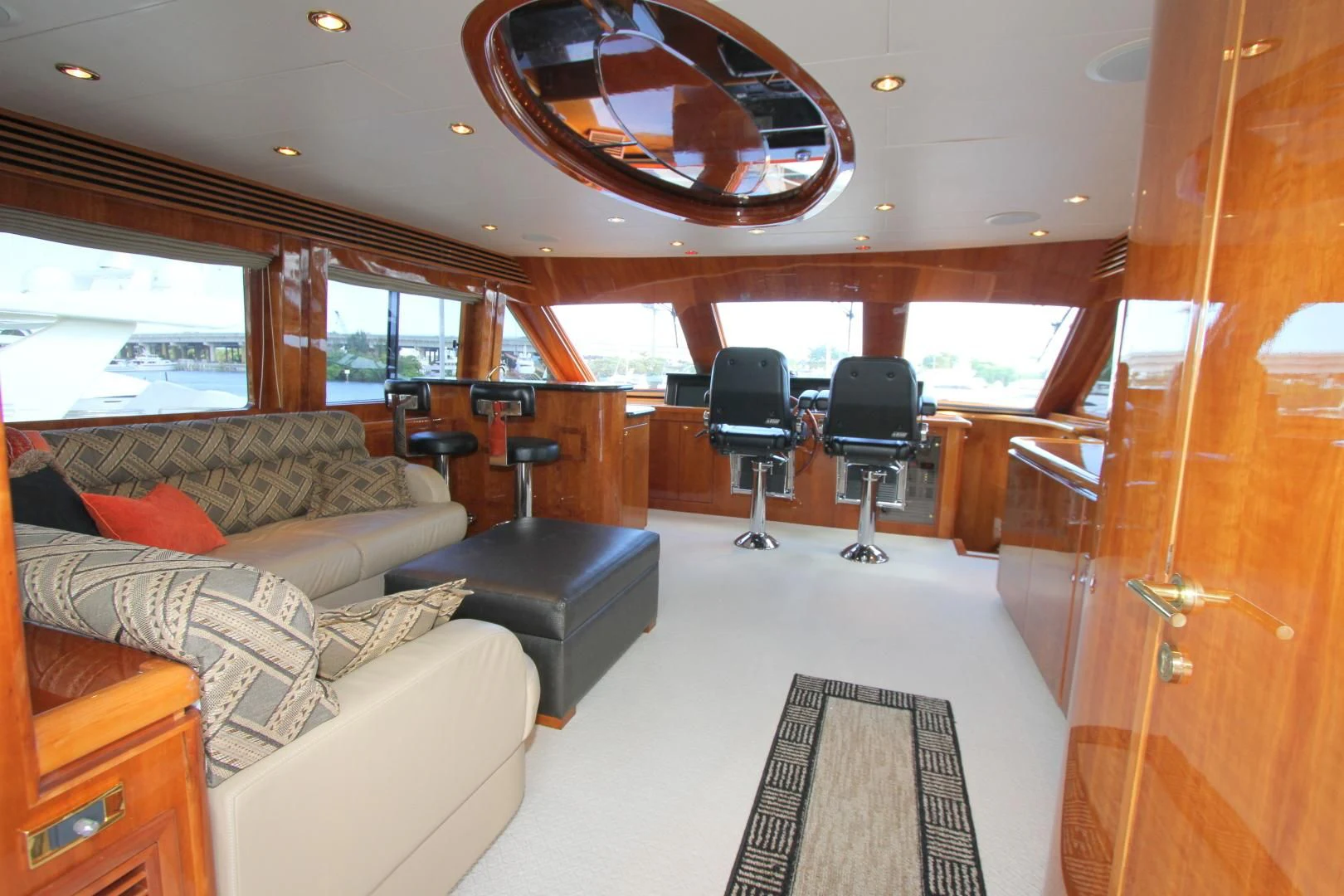 a living room with a couch and a table aboard KISMET Yacht for Sale