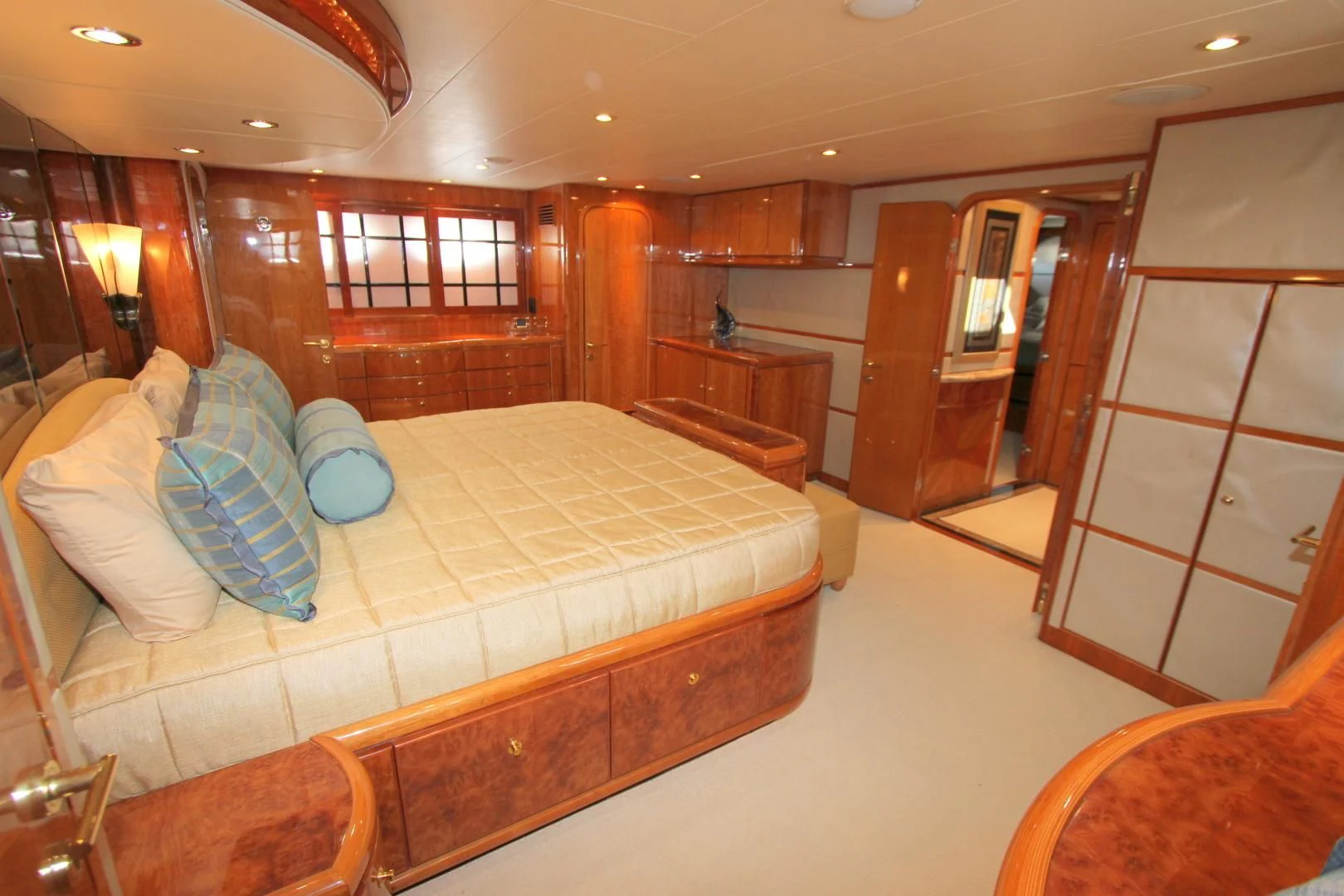 a room with a bed and a chair aboard KISMET Yacht for Sale