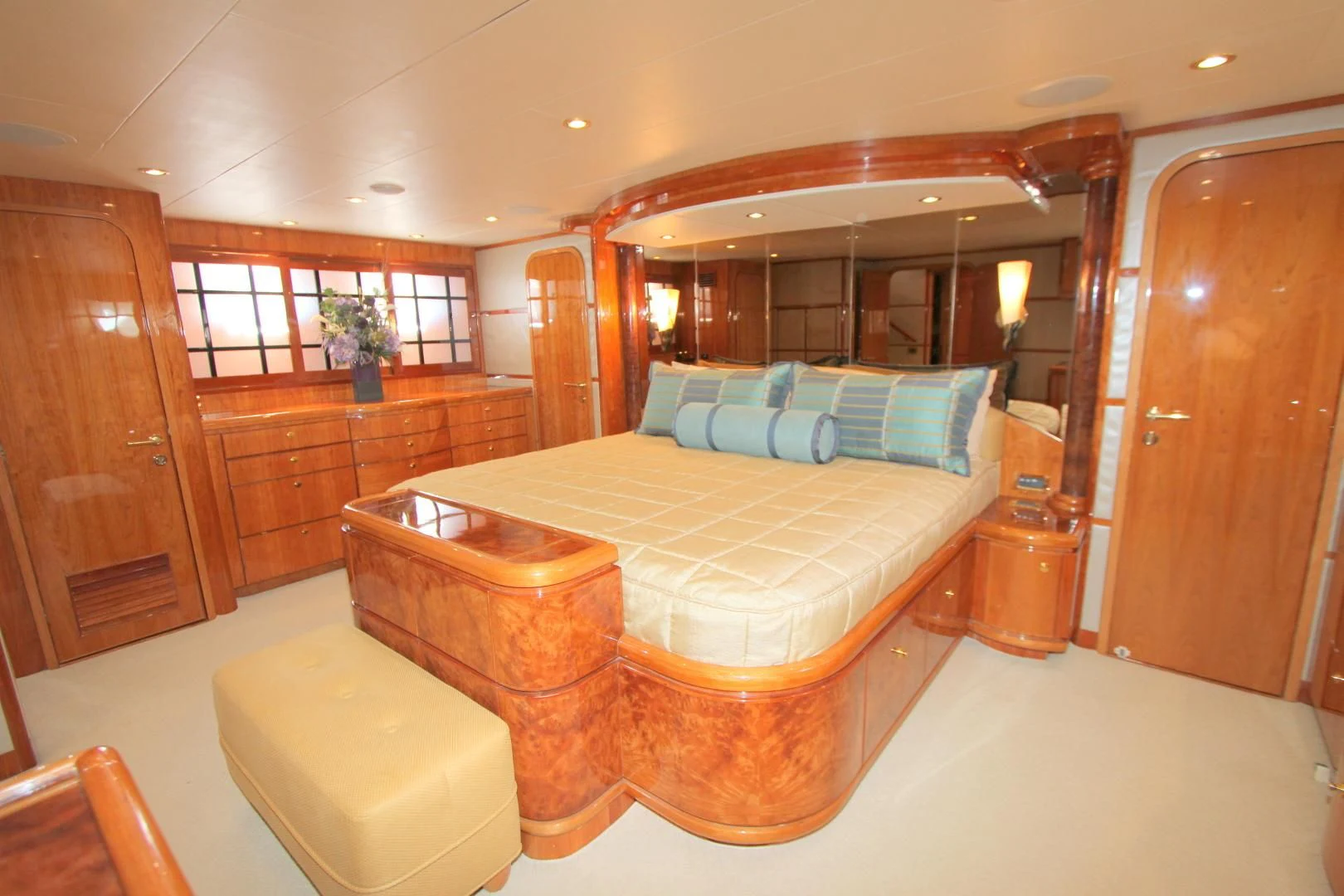 a large bedroom with a large bed aboard KISMET Yacht for Sale