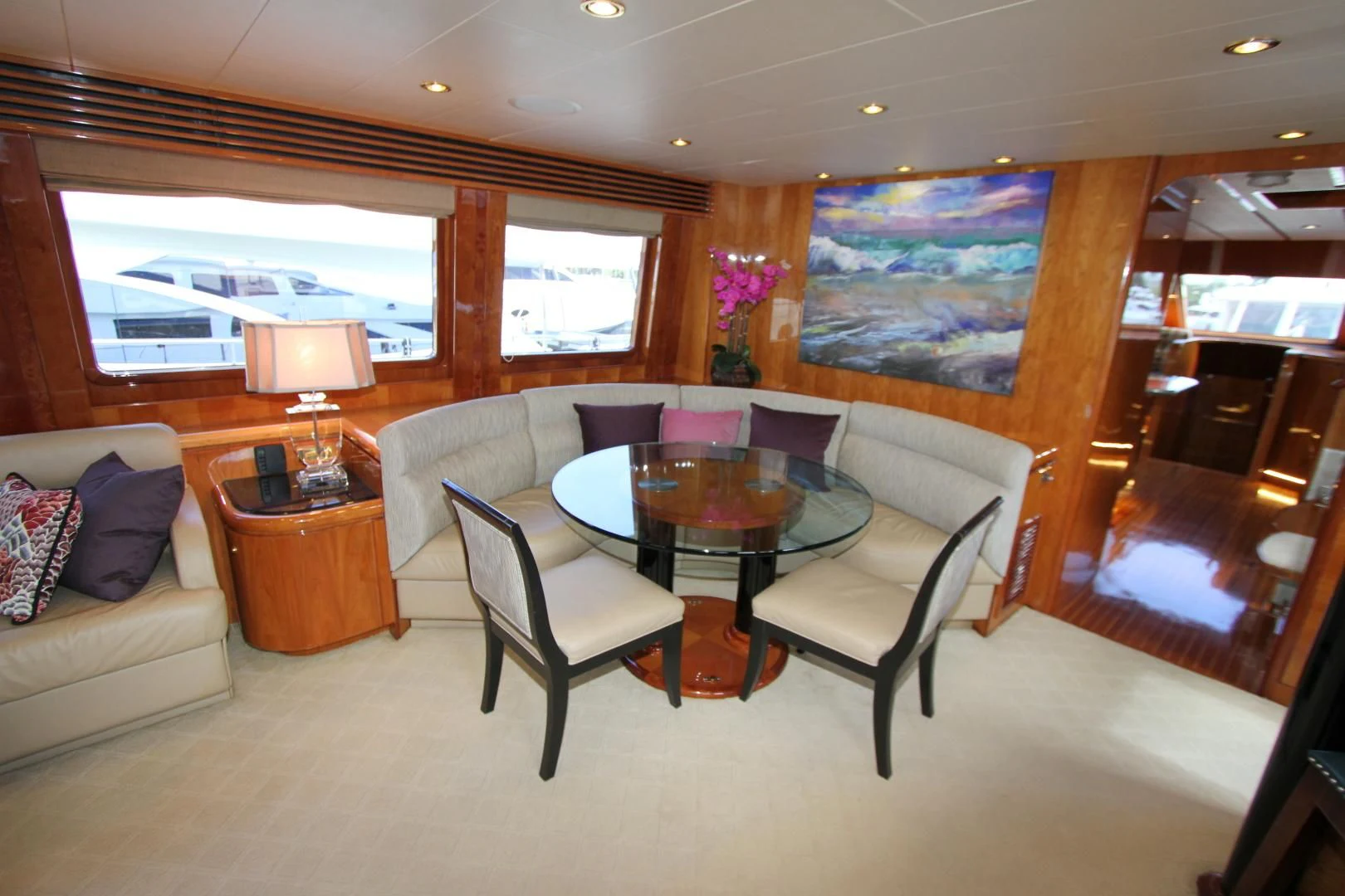 a living room with a table and chairs aboard KISMET Yacht for Sale