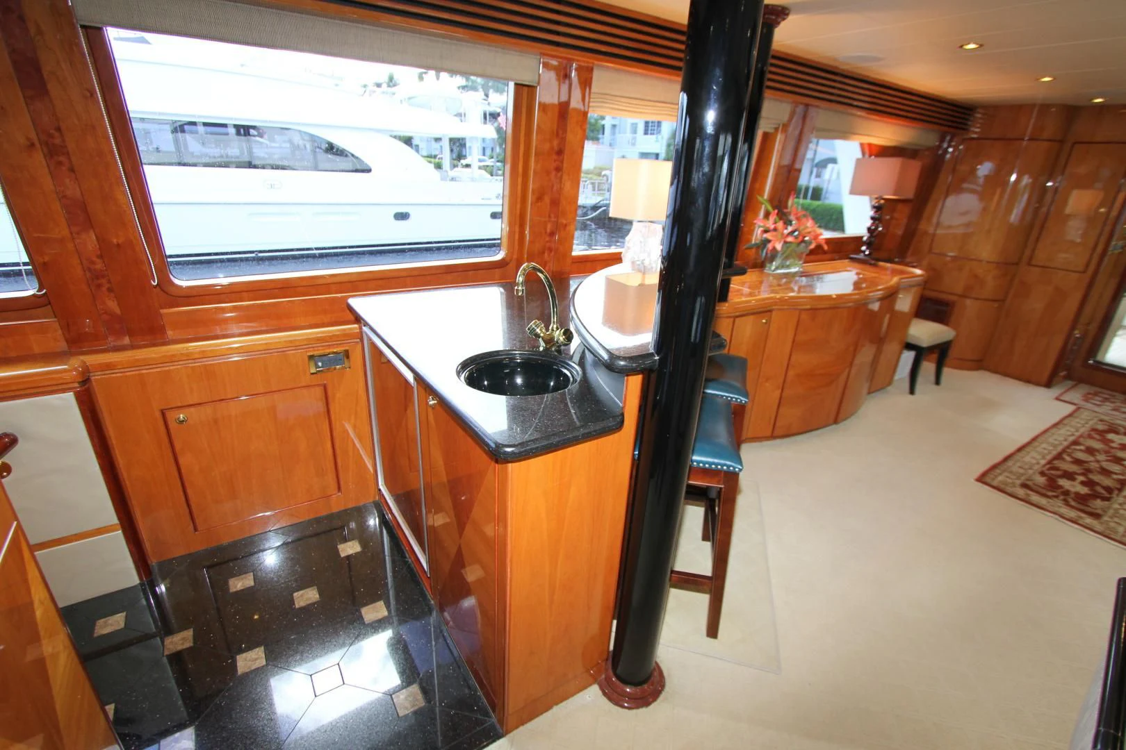 a kitchen with a sink and a mirror aboard KISMET Yacht for Sale