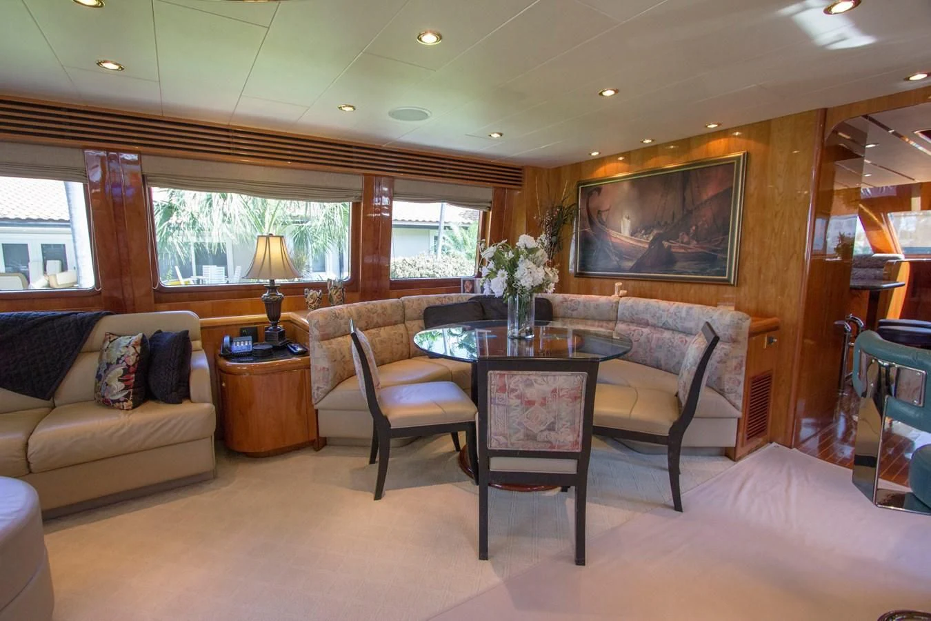 a living room with a table and chairs aboard KISMET Yacht for Sale