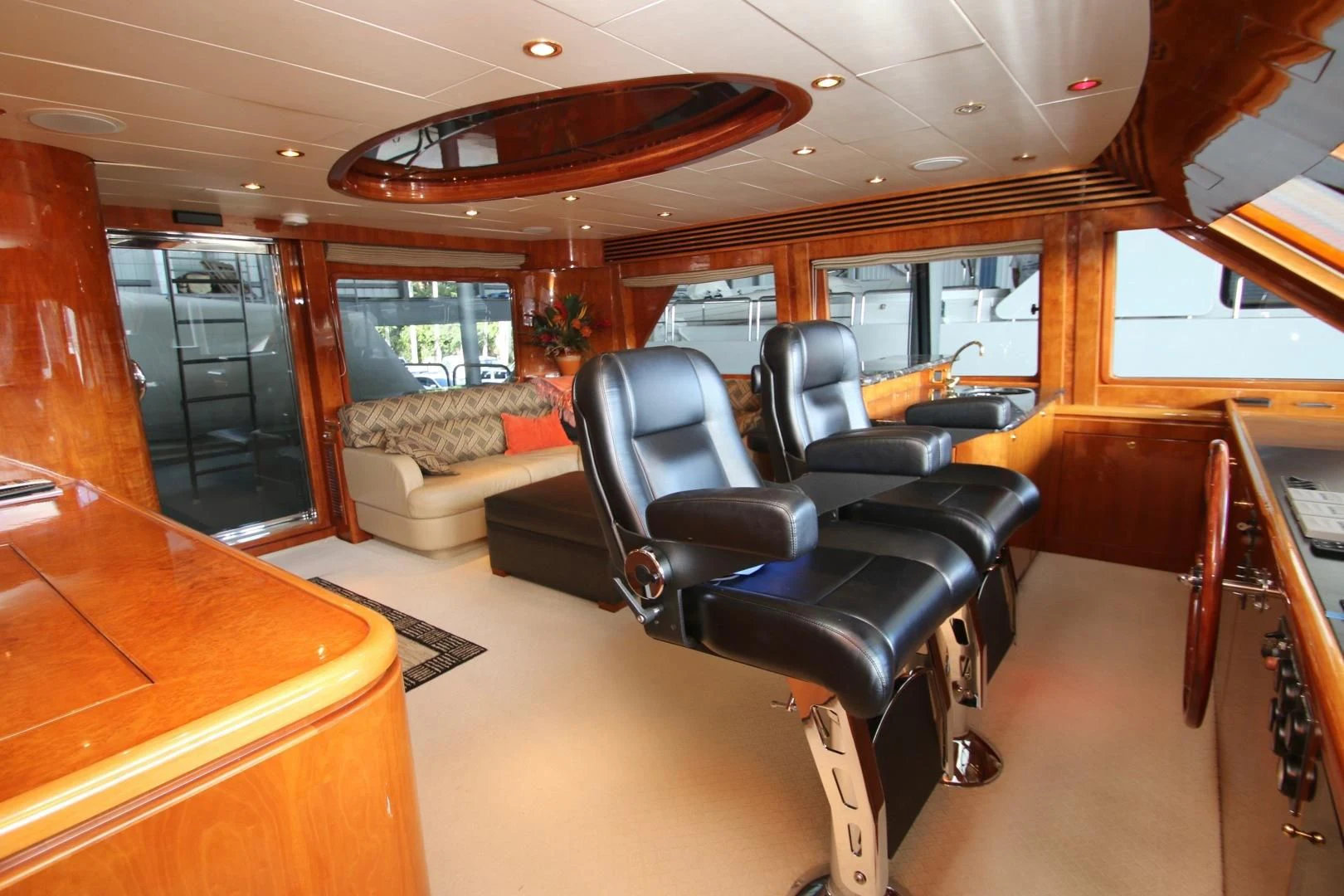 a room with a couch and a table and a chair aboard KISMET Yacht for Sale