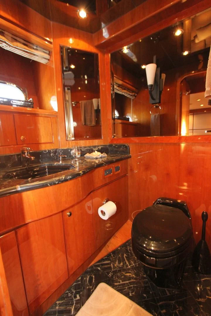 a bathroom with a large mirror aboard KISMET Yacht for Sale