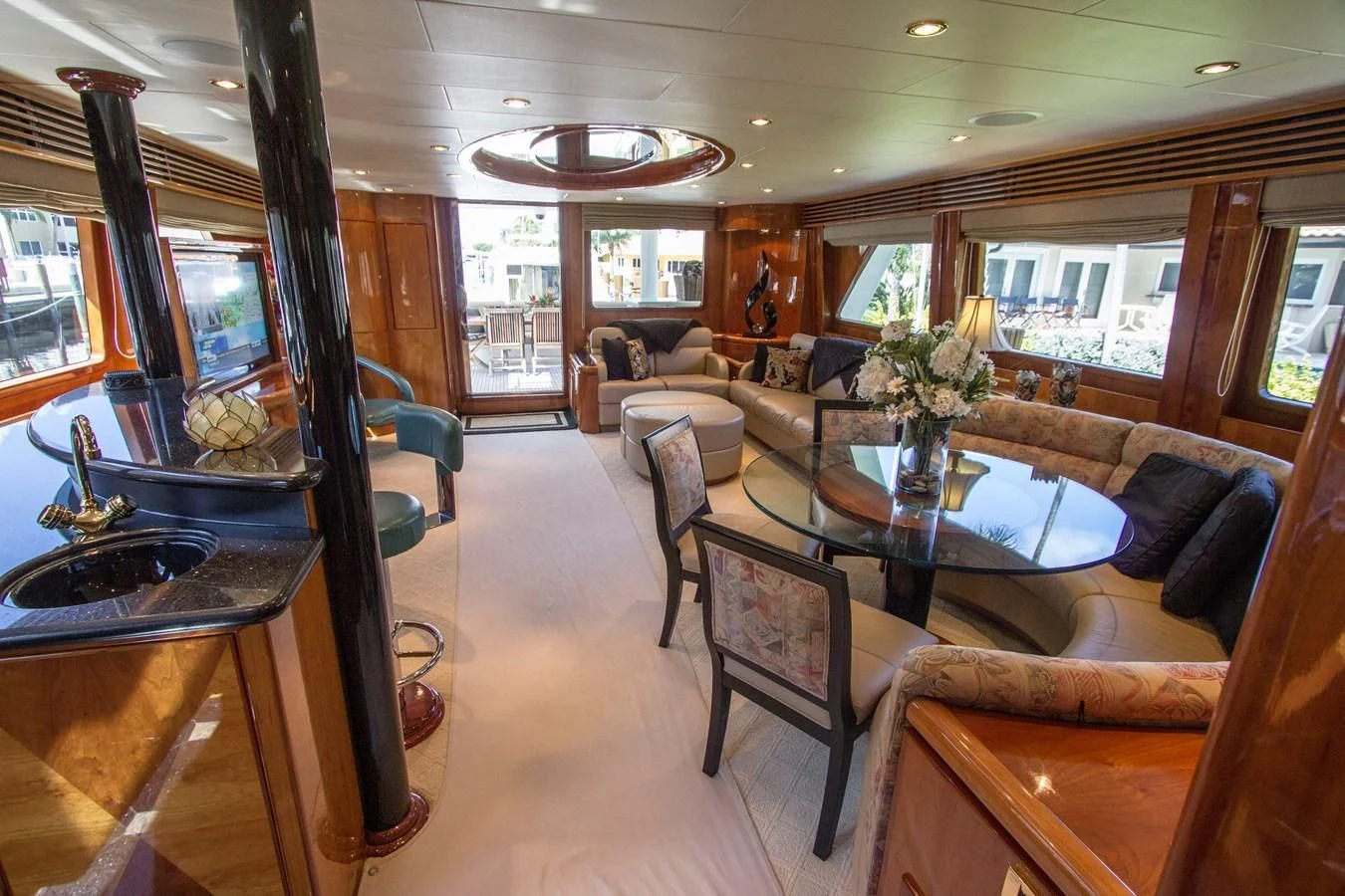 a living room with a table and chairs aboard KISMET Yacht for Sale