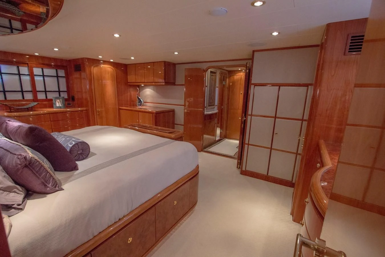 a bedroom with a bed and a closet aboard KISMET Yacht for Sale